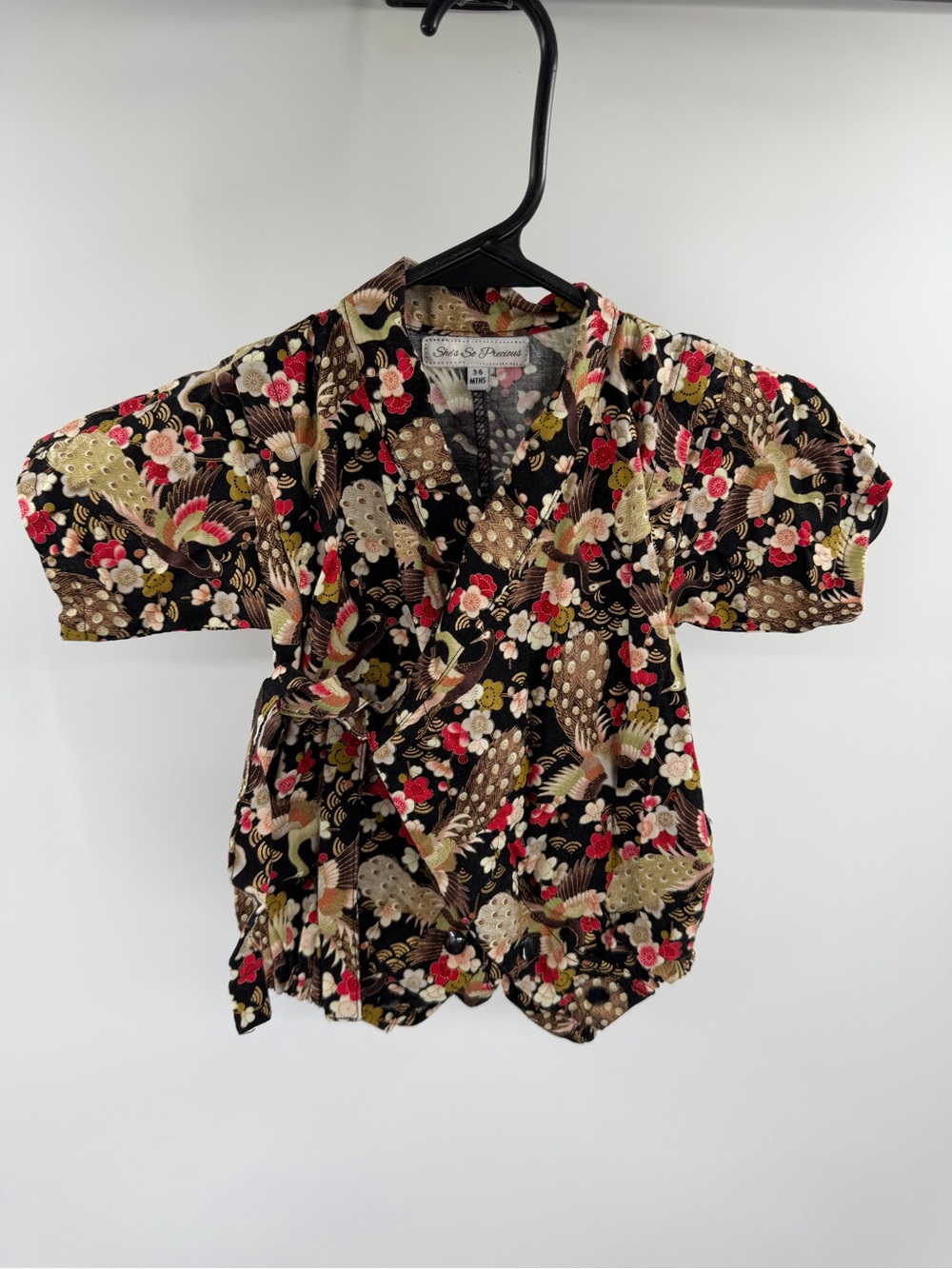 She’s So Precious Shirred Wrap Onesie with Floral & Crane Print Black 3-6 months